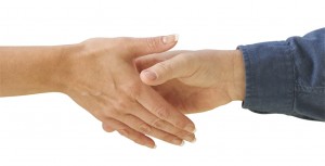 Man and woman shaking hands isolated on a white background.